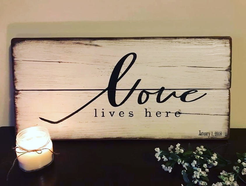 love lives here wood sign